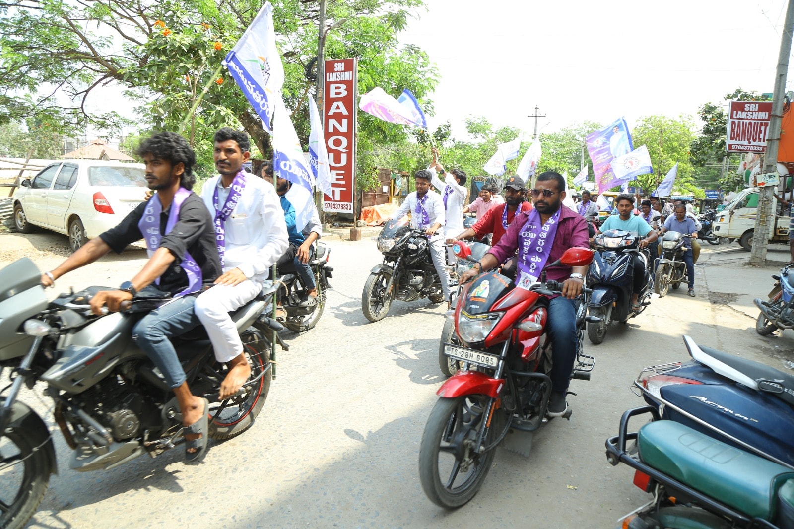 Yuva Taram Party bike rally with party flags